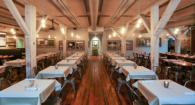 inside of 11th and Bay restaurant showing tables