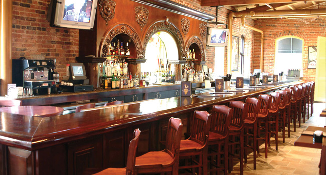 interior bar and bar stools at Houlihans restaurant